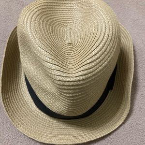 Panama hat with black ribbon.